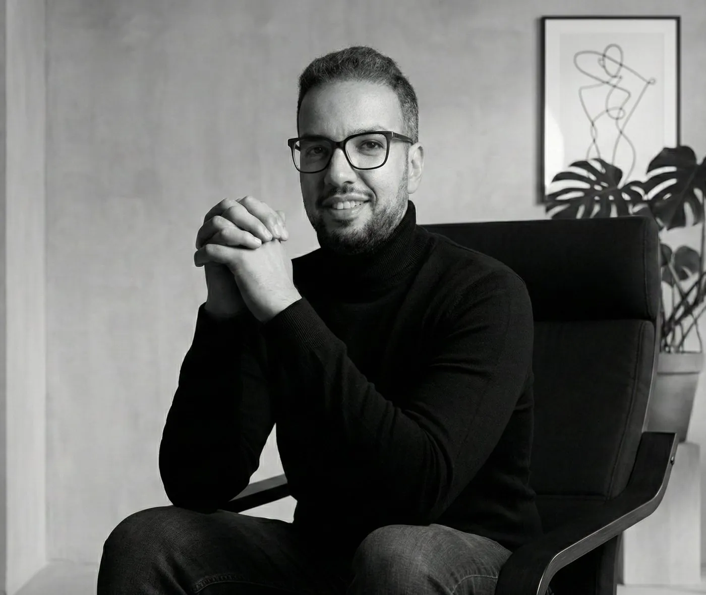 Albear Halim, product designer, seated in his studio